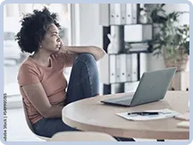Overwhelmed woman at her desk