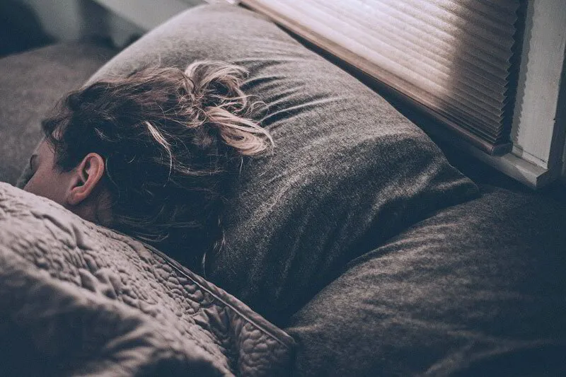 Woman sleeping soundly in bed